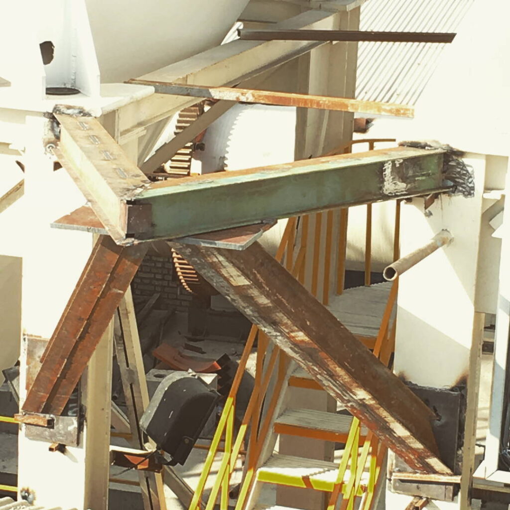 Close-up of heavy-duty steel beam intersections with visible industrial welds.